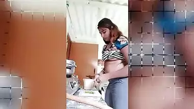 Chubby Desi gal while cooking can barely hide her perky XXX boobs