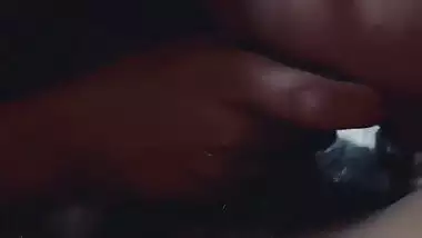 Slim girlfriend smiling while giving handjob and blowjob