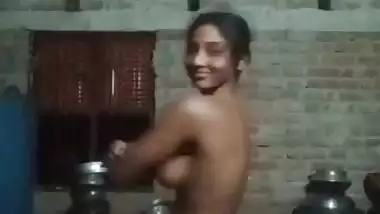 Village girl applying lotion to full nude body